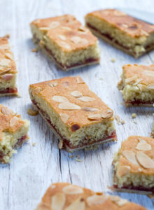 Almond Slice recipe, delicious traybake with a pastry base, jam layer and almond sponge top.