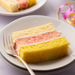 Traditional British Angel Cake served on a plate with a fork.