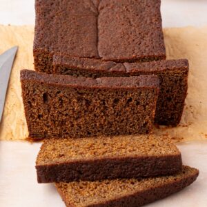 Sliced gingerbread loaf showing the dark, moist crumb.