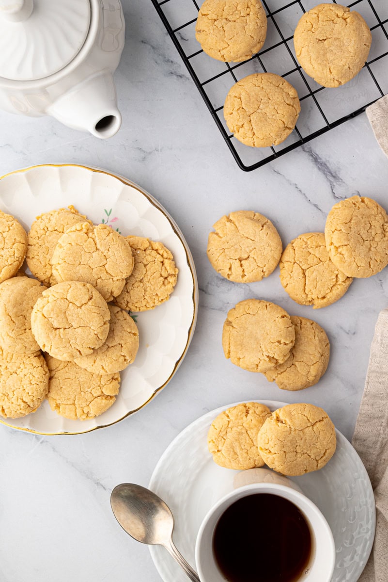 Overhead view of gingernut biscuits cooling and ready to serve with tea