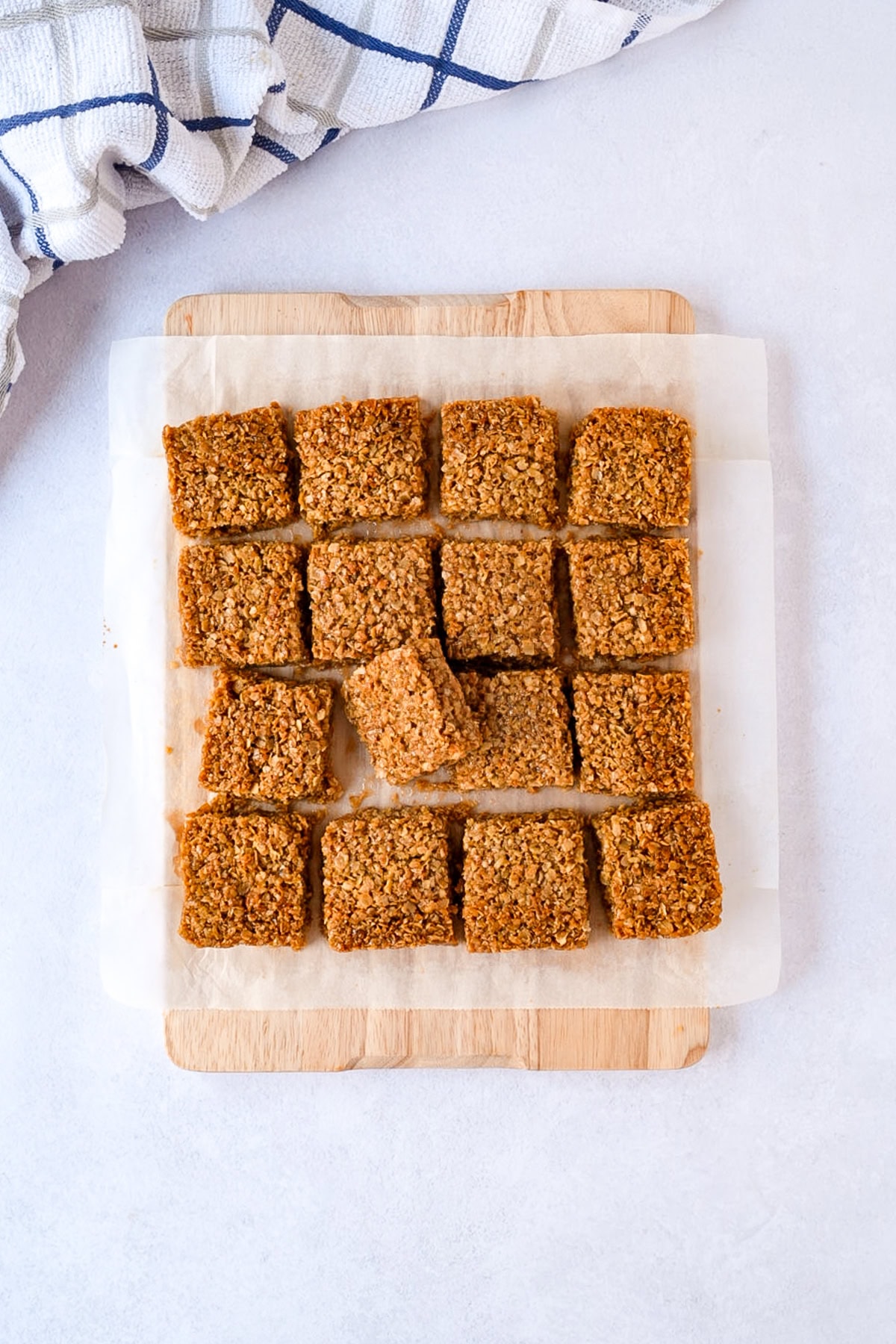 Cut flapjack squares showing the thick, soft and chewy oat centre.