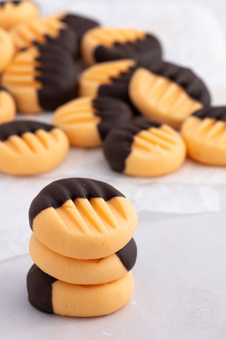 Stack of homemade orange creams dipped in dark chocolate – festive treat or edible Christmas gift.