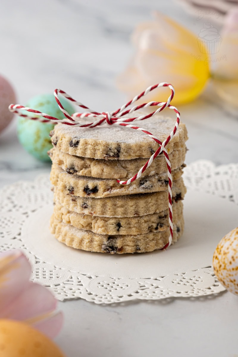 Detailed view of Easter biscuits showing their crumbly texture, currants and sugar-coated tops.