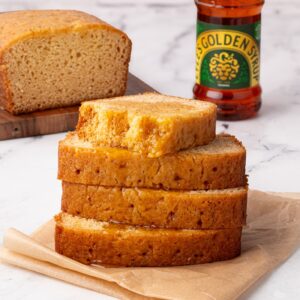 Slices of golden syrup cake showing a soft, sticky crumb.
