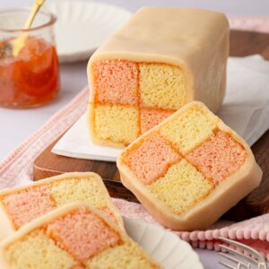 Classic Battenberg cake with pink and plain checkerboard sponge.