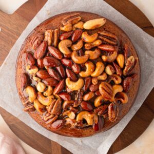 Honey Nut Cake topped with mixed nuts and honey.