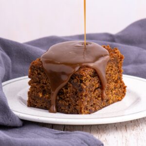 Sticky toffee pudding topped with rich, glossy toffee sauce.