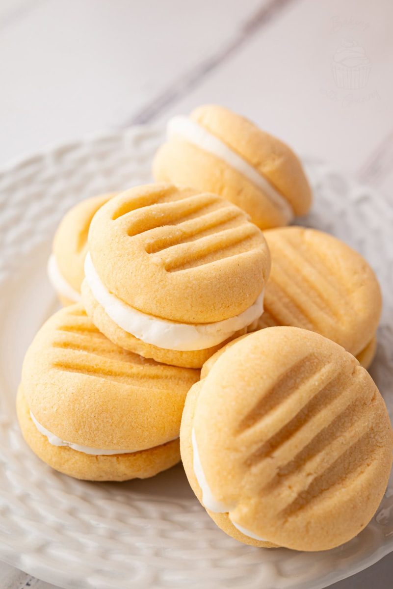 Custard Creams Small plate of custard creams stacked, showing biscuit ridges and creamy filling.